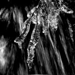 Icicles in front of&nbsp;waterfall