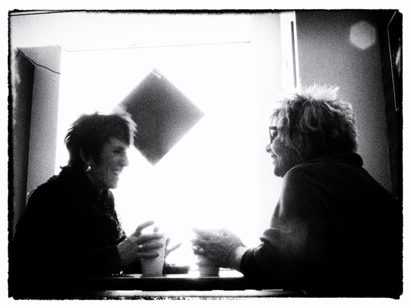 2 ladies chatting over coffee