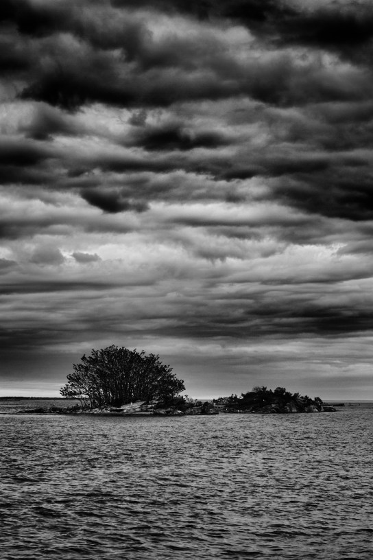 Stormy clouds over small island