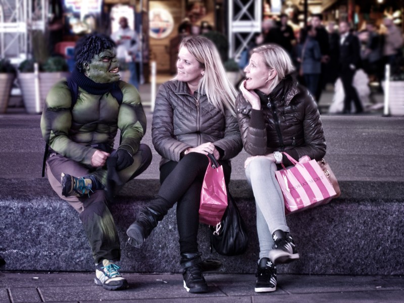 tourists chatting with a Hulk character