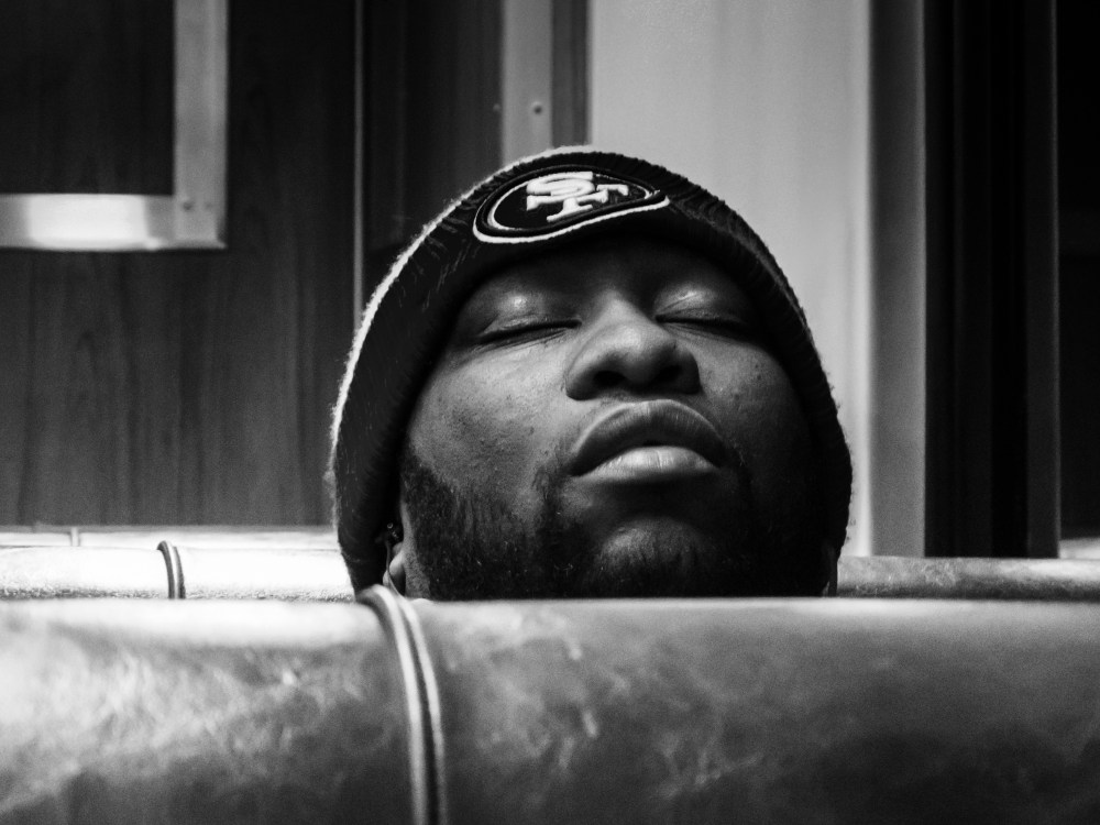 man sleeping in train car