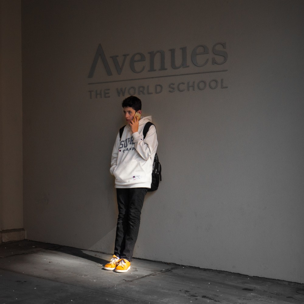 boy wearing orange sneakers
