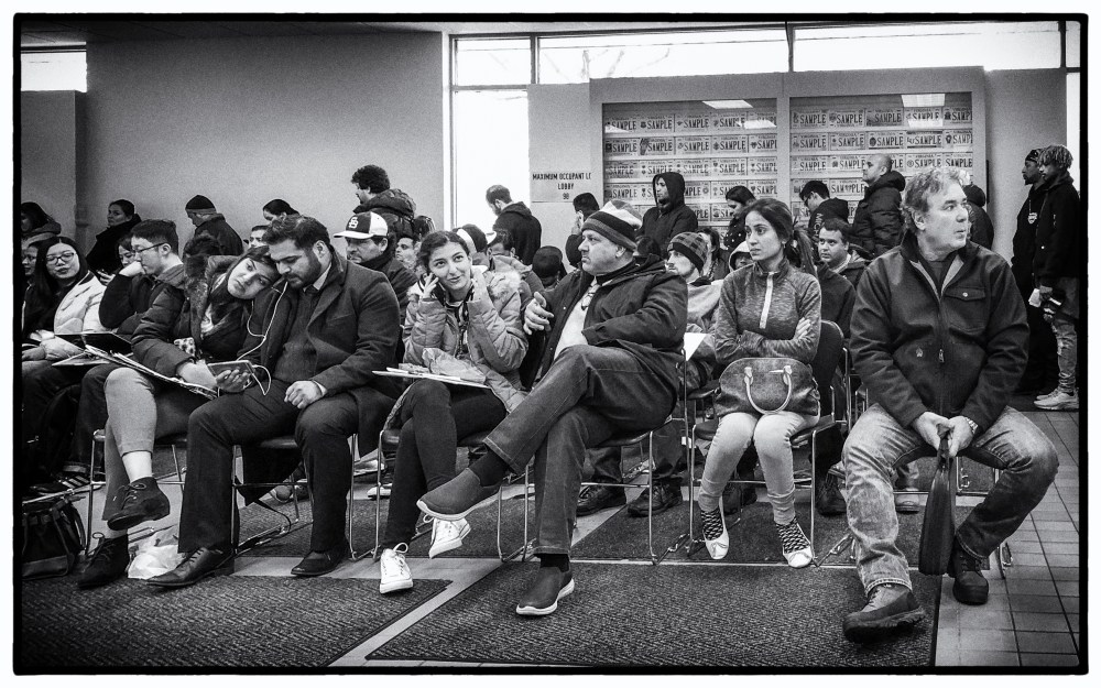 bored people waiting at the DMV office