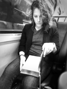 Woman reading on subway